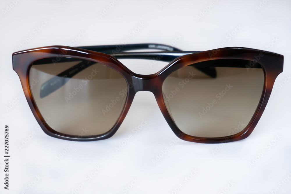 Brown unisex sunglasses on white background