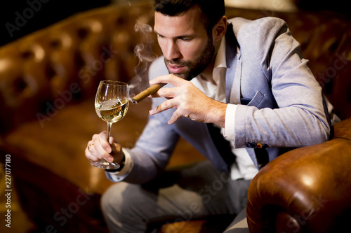 Rich businessman drinks win...