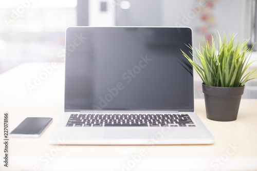 Laptop and mobile phone on ...