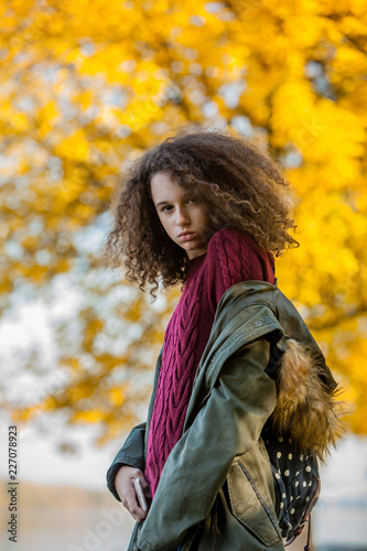 Teen girl in autumn park