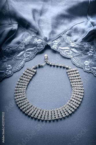 Faux diamond necklace and lace trimmed lingerie.
