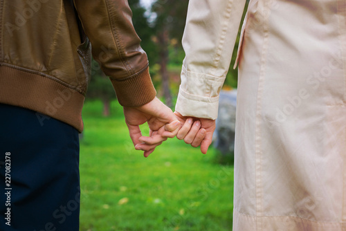 women's and men's hands together