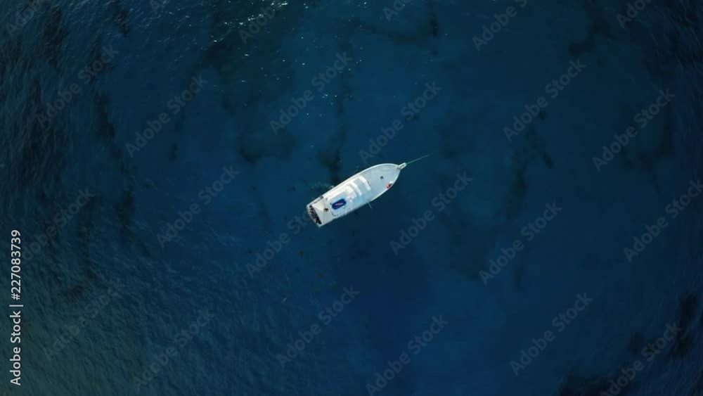 Overhead aerial, boat on ocean surface