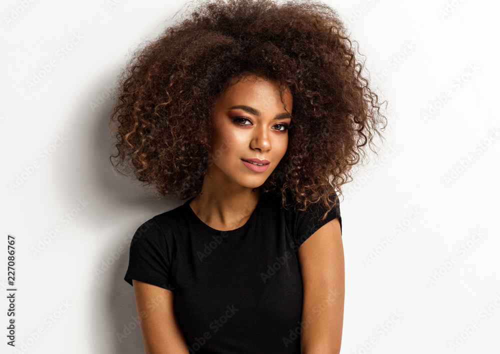 Portrait of beauty african american woman with afro hairstyle isolated on white background