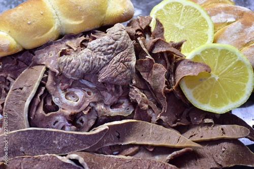 Panino con milza, tipico cibo da strada della città di palermo photo
