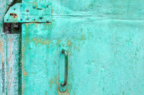 part of an old shabby green door