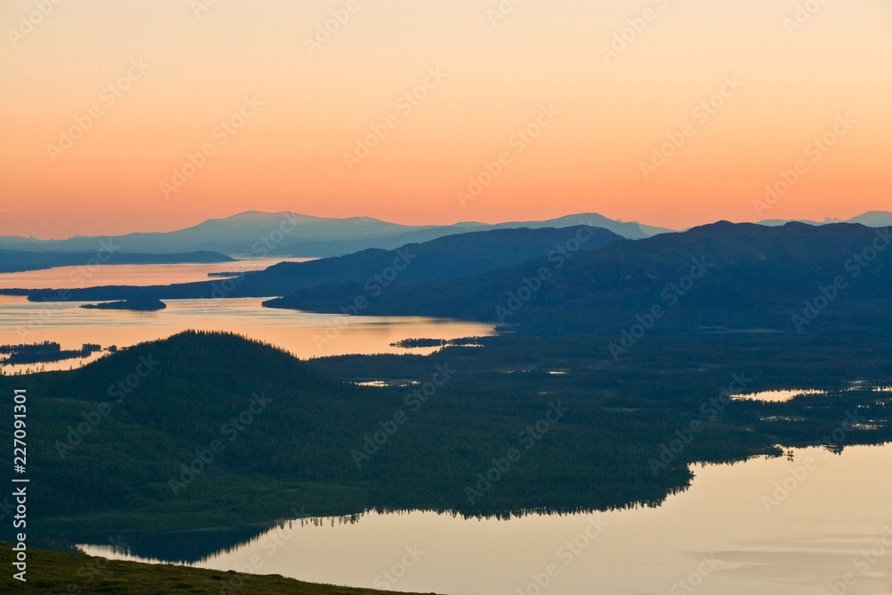 Breathtaking panorama of lakes from mountain top, midnight sun, Lappland north Sweden