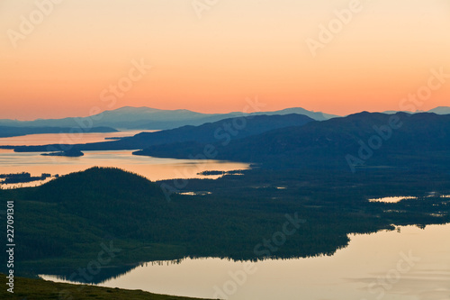 Breathtaking panorama of lakes from mountain top, midnight sun, Lappland north Sweden photo