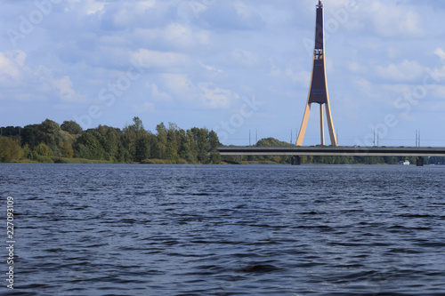 Behind the bridge is tower.