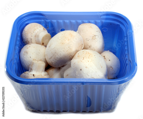 White Mushrooms In Supermarket Packaging