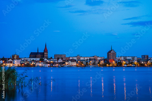 Rostock. Night Panorama view to Rostock in Germany. River Warnow and City port. © eplisterra