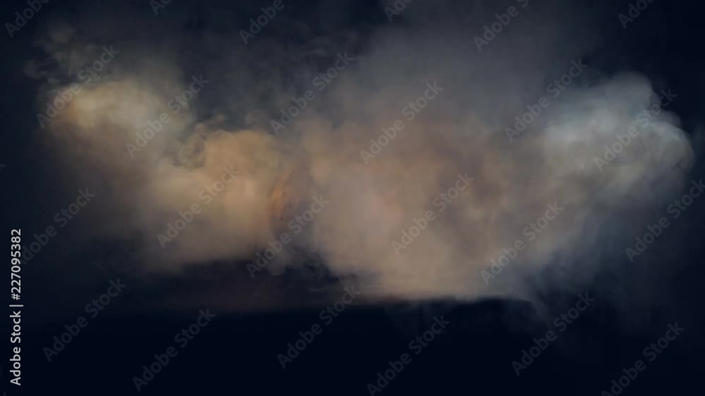 Orange halloween pumpkin on a table surrounded with smoke, close up. Orange halloween pumpkin on a table surrounded with smoke, close up.