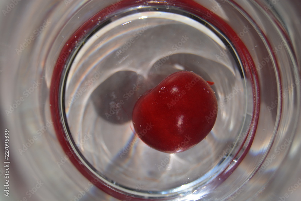 Cherries in a glass cup, an unusual circle Cherries in a glass cup, an unusual circle