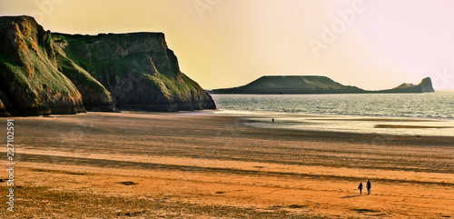 Beach at sunset in Rhossili Bay, Wales photo