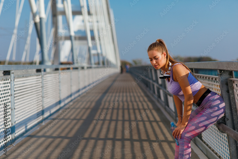 Young sports woman resting after a jogging
