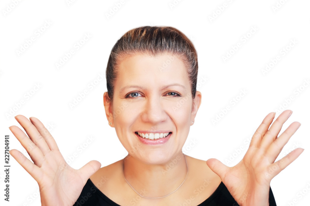 Woman cheerfully shakes hands and smiles genuinely on a white background. A woman is happy because she has a good news Woman cheerfully shakes hands and smiles genuinely on a white background. A woman is happy because she has a good news