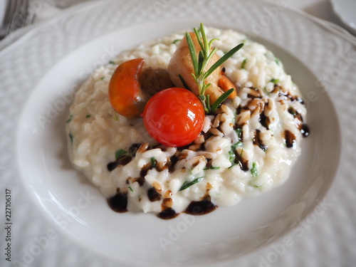 Risotto with seafood with cherry tomatoes and balsamic vinegar