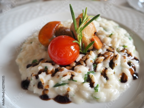 Risotto with seafood with cherry tomatoes and balsamic vinegar