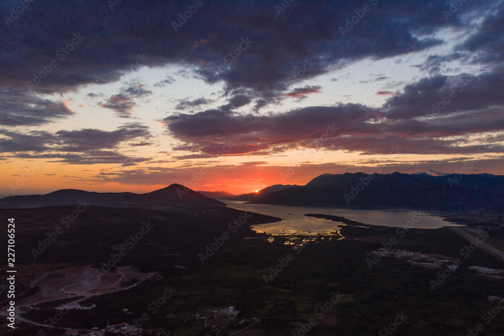 aerial view of sunset over tivat in kotor bay