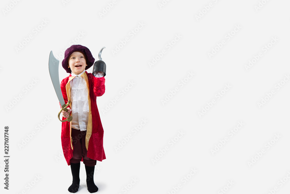 Happy boy dressed up in a pirate Halloween Costume Happy boy dressed up in a pirate Halloween Costume