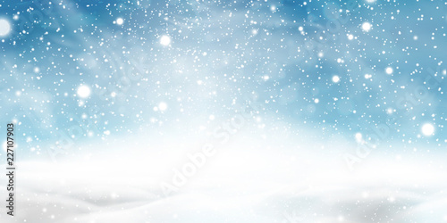 Natural Winter Christmas background with blue sky, heavy snowfall, snowflakes in different shapes and forms, snowdrifts. Winter landscape with falling christmas shining beautiful snow. photo