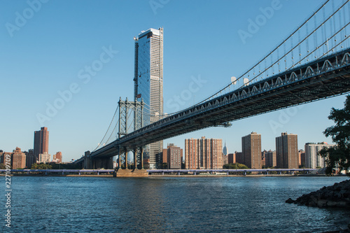 Manhattan Bridge over East River at the early morning sun light. The Bridge connects Lower Manhattan with Brooklyn of New York, USA. © Xavier Lorenzo