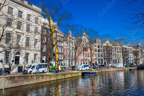 Canals, boats and beautiful architecture at the Old Central district in Amsterdam