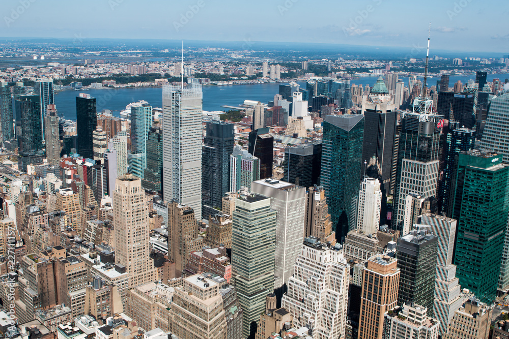 Fototapeta premium Aerial view of New York City - USA. Manhattan downtown skyline and skyscrapers from the Empire State Building in the morning.