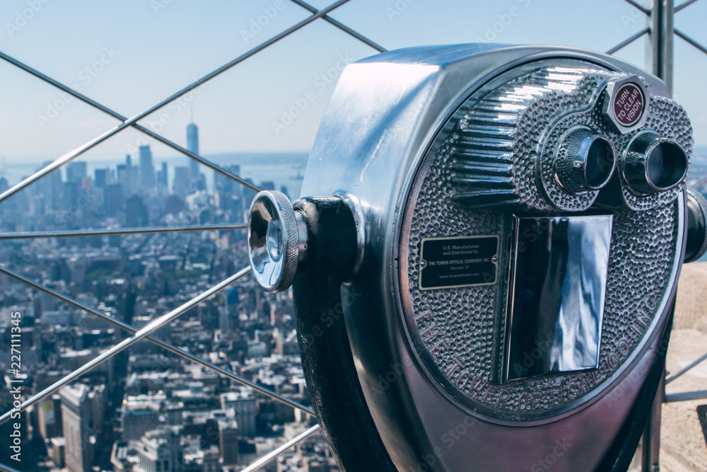 Tourist binoculars at the top of the Empire State Building in New York City Tourist binoculars at the top of the Empire State Building in New York City