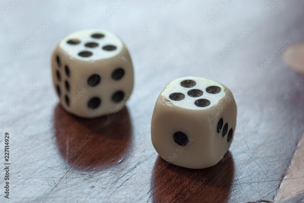 White dice on wooden background. Concept of luck, chance and leisure fun, number 5 White dice on wooden background. Concept of luck, chance and leisure fun, number 5