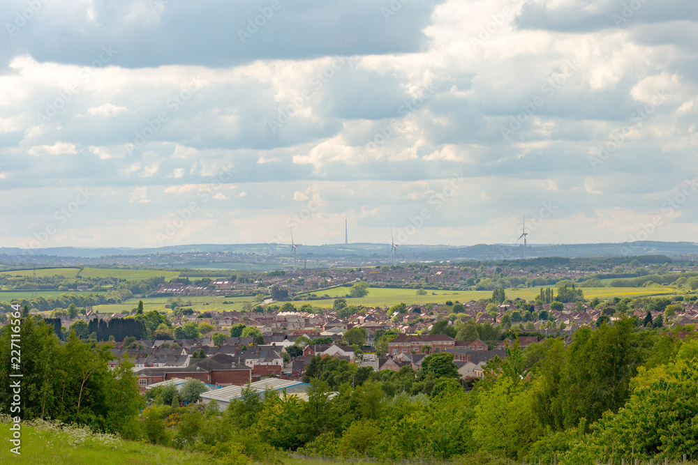 A view from Phoenix Park on a television tower and a rural landscape in England.