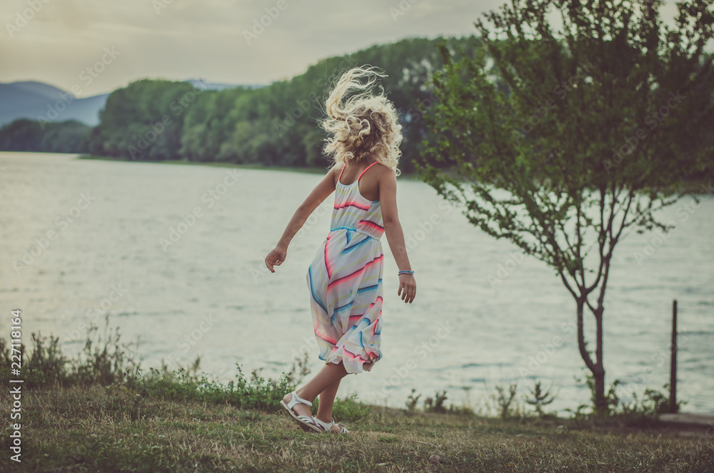 lovely child dancing at the lake lovely child dancing at the lake