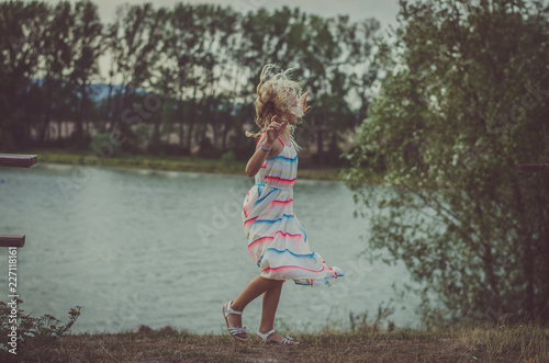 lovely child  dancing at the lake