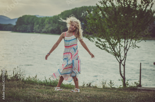lovely child  dancing at the lake