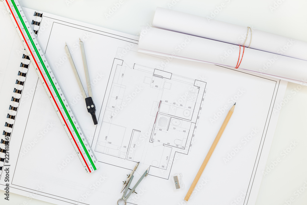 Interior designer table workplace with house plan Interior designer table workplace with house plan