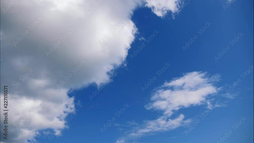 Timelapse. White clouds float across a blue sky. Timelapse. White clouds float across a blue sky.