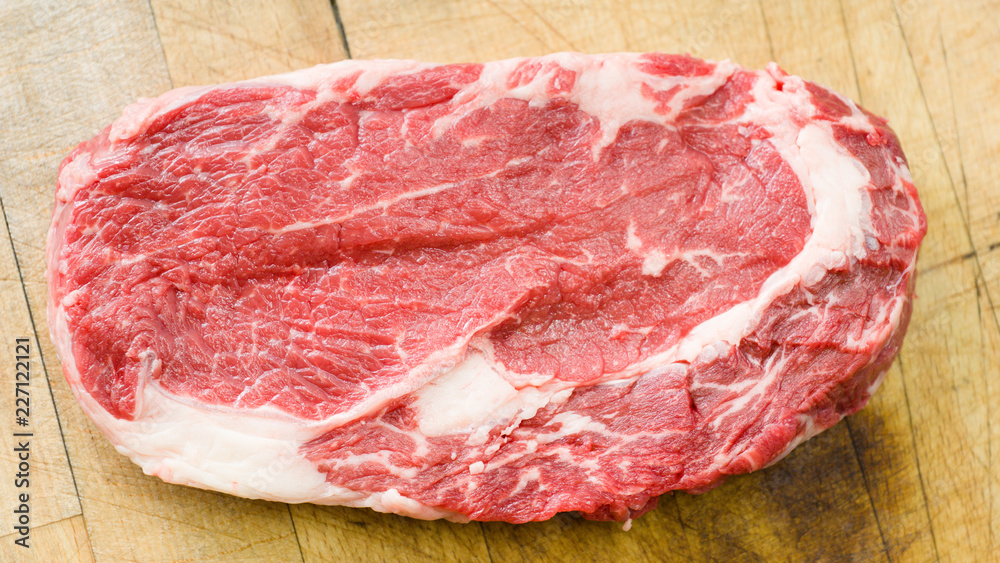 Raw marbled beef on a cutting board