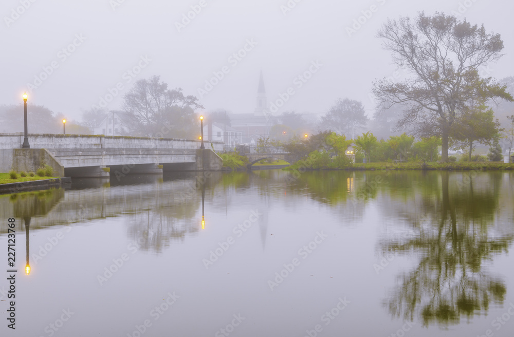 Foggy autumn morning at Asbury Park, New Jersey featuring dreamy view of the lake 