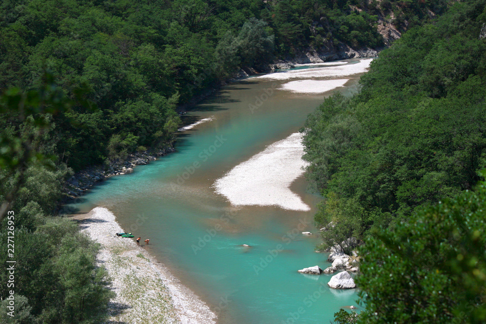 People and kayaks on the riverbank, Verdon Gorge, France