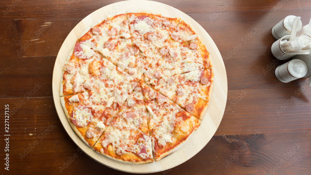 Homemade pizza with sausage and cheese Homemade pizza with sausage and cheese