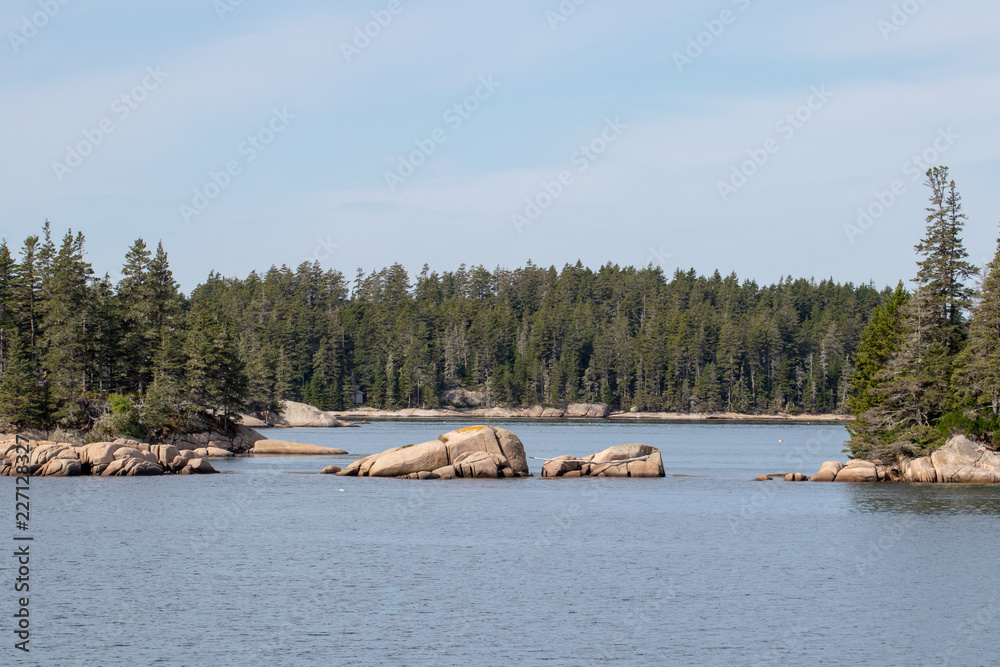 peaceful view of island with rocky coastline in Maine peaceful view of island with rocky coastline in Maine