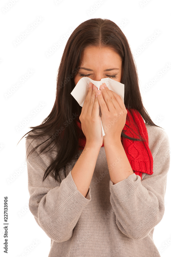 Ill woman with flu blows in handkerchief isolated over white background Ill woman with flu blows in handkerchief isolated over white background
