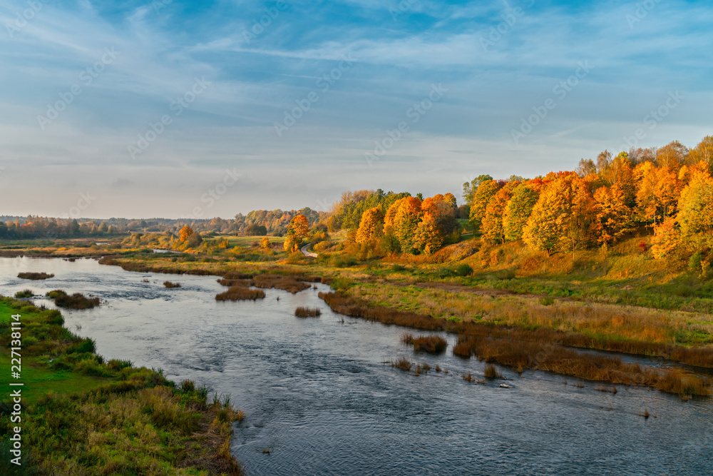 Autumn river valley landscape. Autumn river valley landscape. Latvia, Kuldiga. Europe