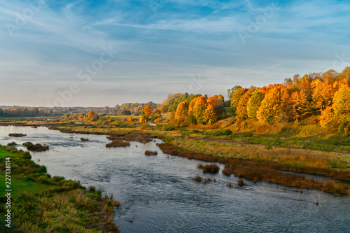 Autumn river valley landscape. Autumn river valley landscape. Latvia, Kuldiga. Europe
