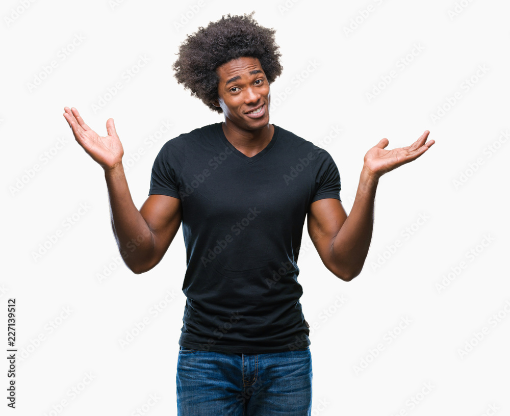 Afro american man over isolated background clueless and confused expression with arms and hands raised. Doubt concept. Afro american man over isolated background clueless and confused expression with arms and hands raised. Doubt concept.