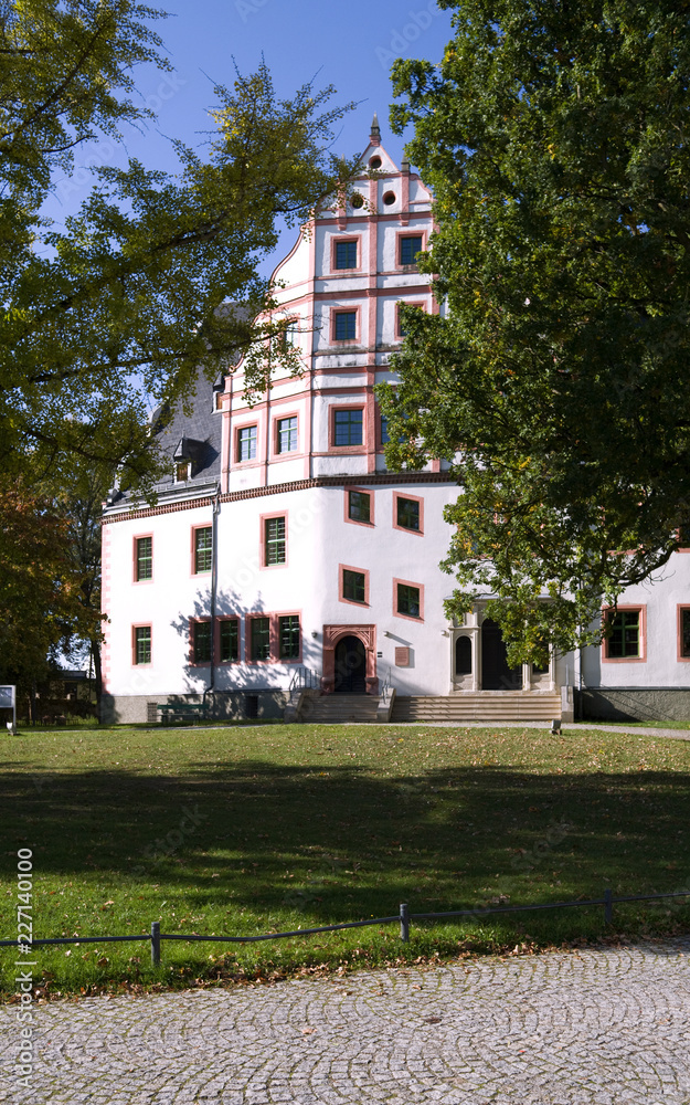 Ponitz / Germany: Renovated Renaissance manor house with Neo-Gothic portal on a sunny day in October