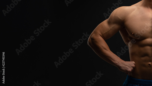 Bodybuilding concept. Strong bodybuilder sports fitness man after bodybuilding training, copy space. person. Strength and Motivation. Banner