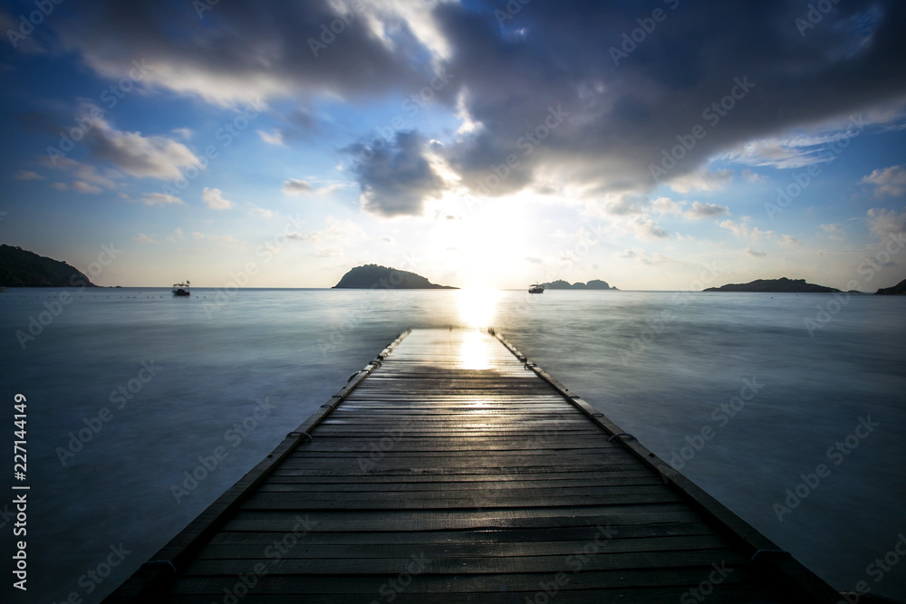 Obraz premium sunset scenery at Redang Island,Malaysia . soft focus,blur due to long exposure. visible noise due to high ISO.