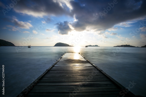 sunset scenery at Redang Island Malaysia . soft focus blur due to long exposure. visible noise due to high ISO.