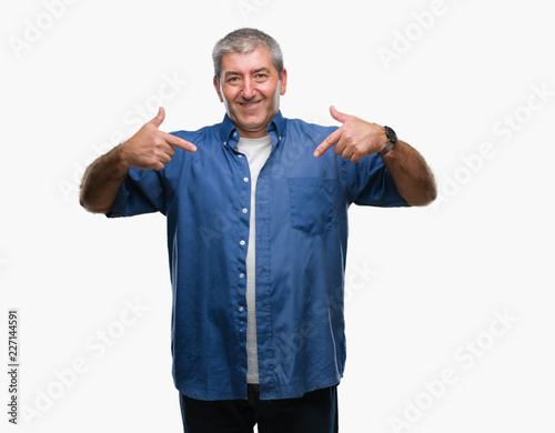 Handsome senior man over isolated background looking confident with smile on face, pointing oneself with fingers proud and happy.